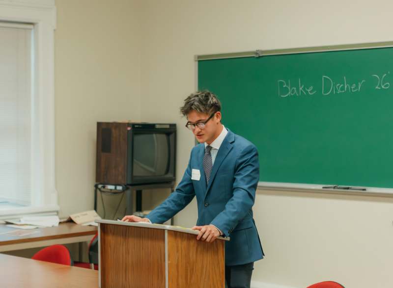 a man standing at a podium