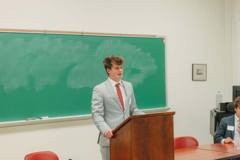 a man standing at a podium