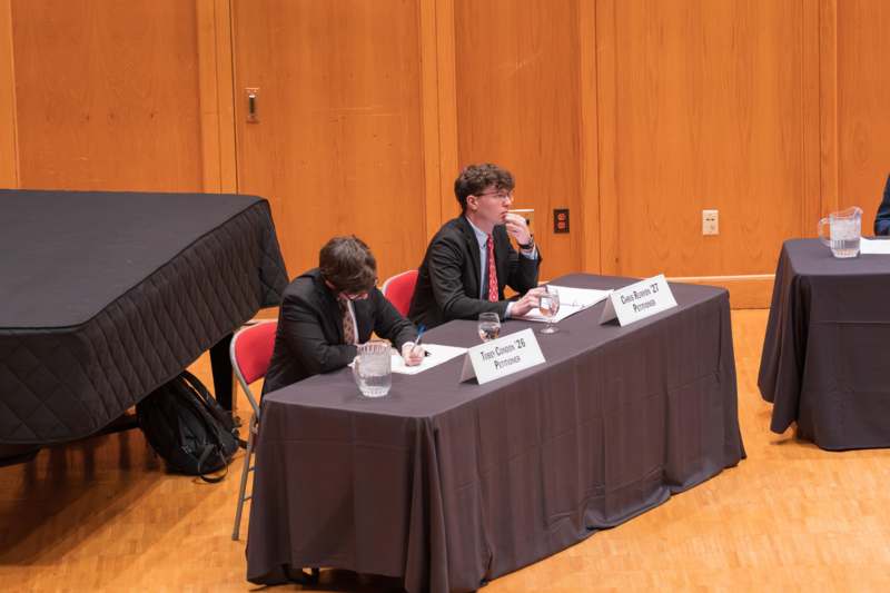 two men sitting at a table