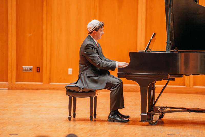 a man playing a piano