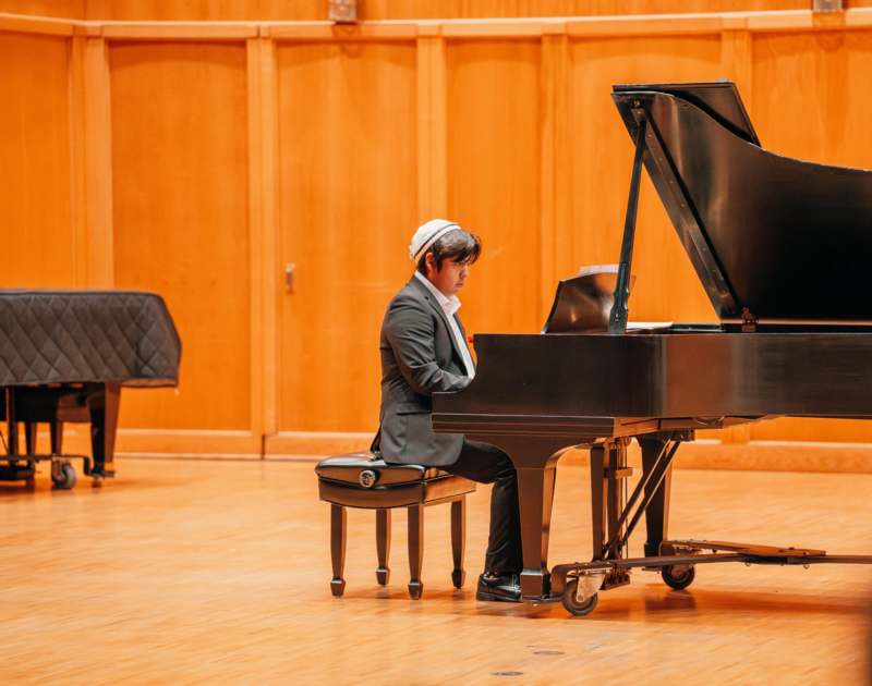 a man playing a piano