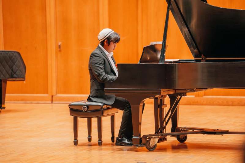 a man playing a piano