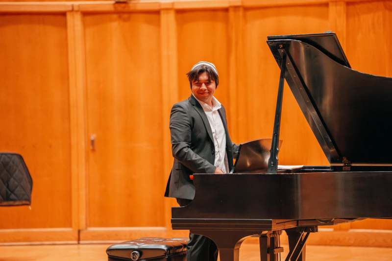 a man playing a piano
