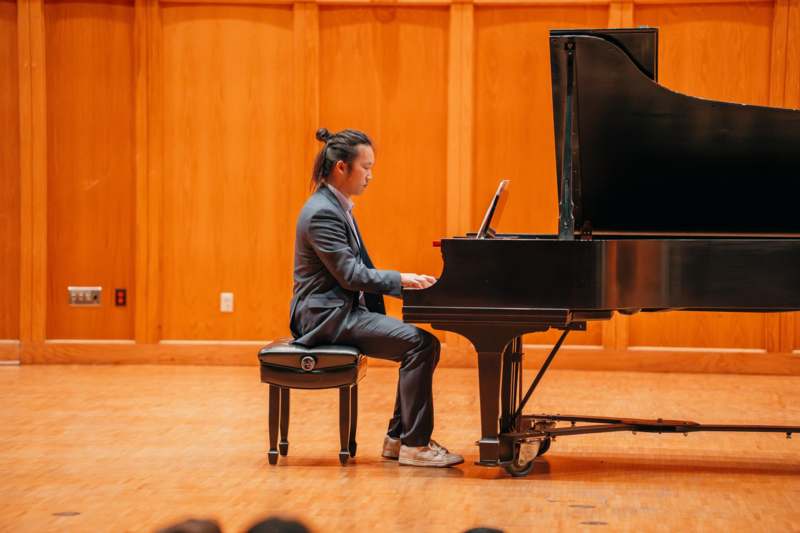 a man playing a piano
