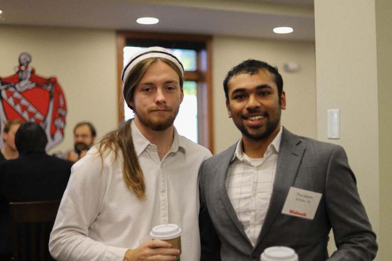 a couple of men standing together