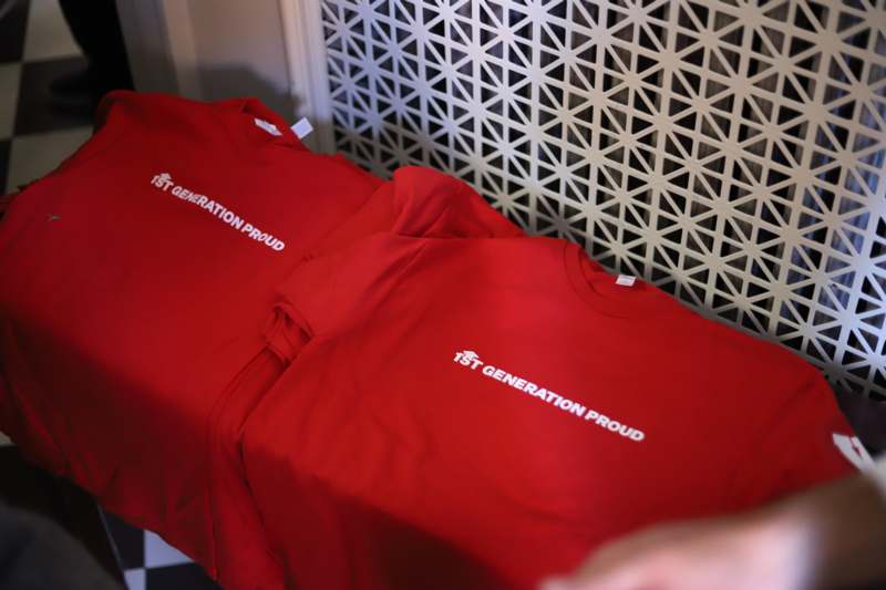 a group of red shirts with white text on them