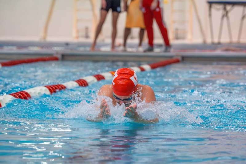 a person swimming in a pool