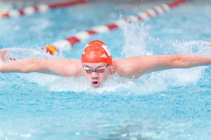 a man swimming in a pool