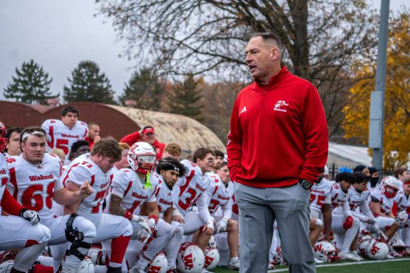 a football coach talking to his players