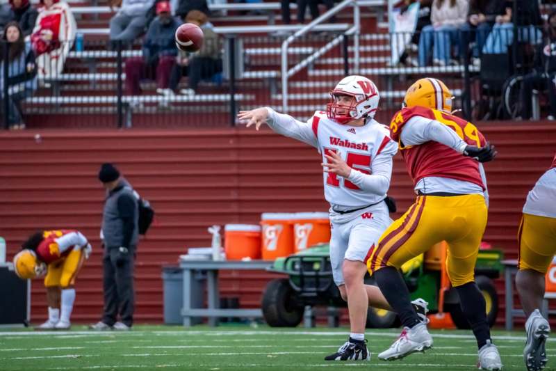 a football player throwing a football