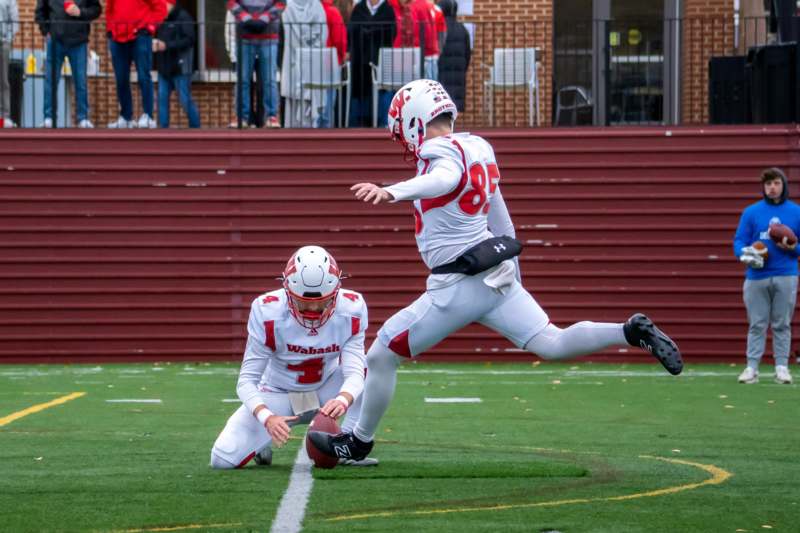 a football player kicking a football