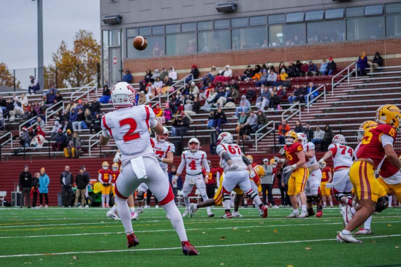a football player throwing a football