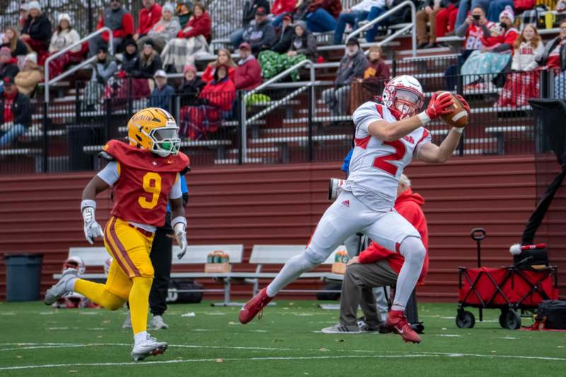 a football player catching a football