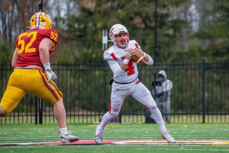 a football player holding a football