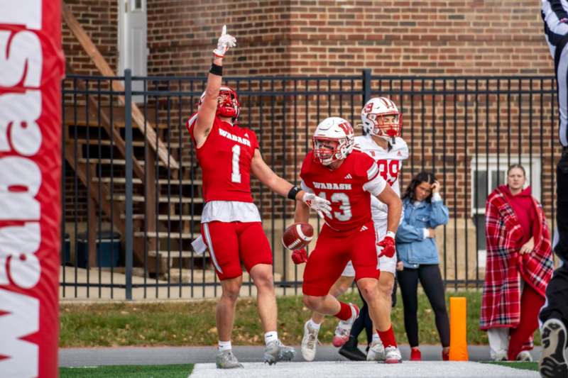 Football vs Wittenberg (11/01/25) - a group of football players running on a field