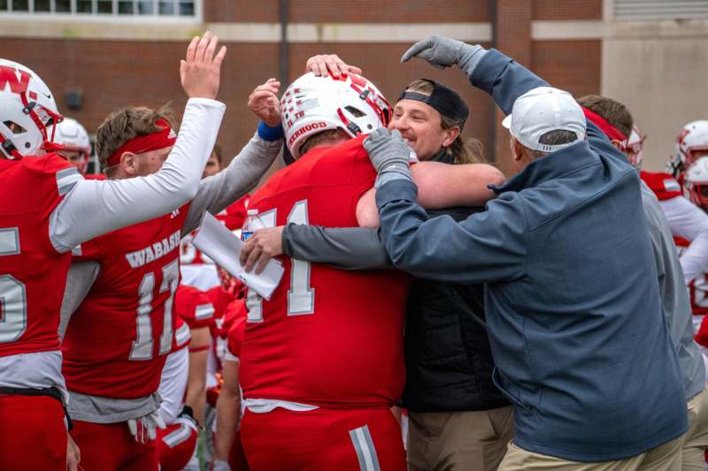 a group of people hugging each other