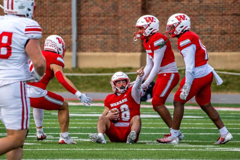 a football player holding a football