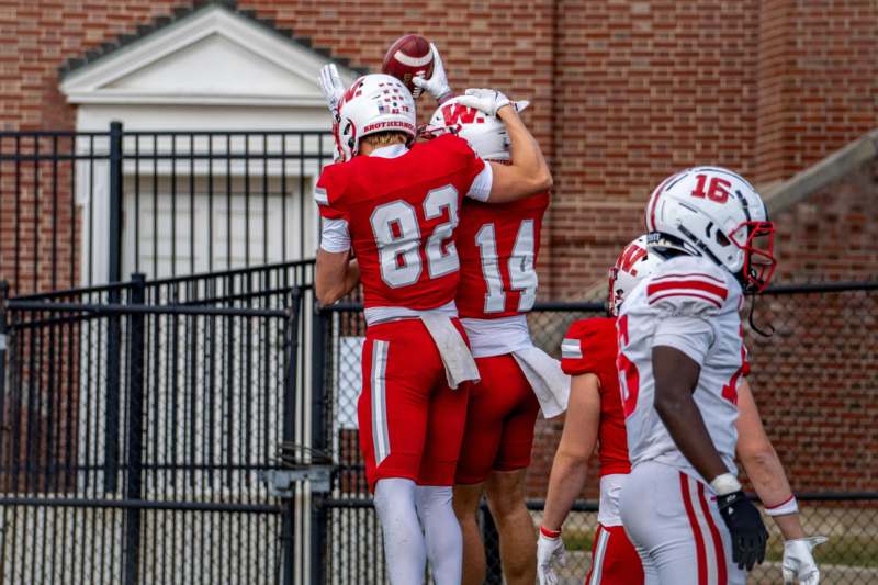 a group of football players hugging