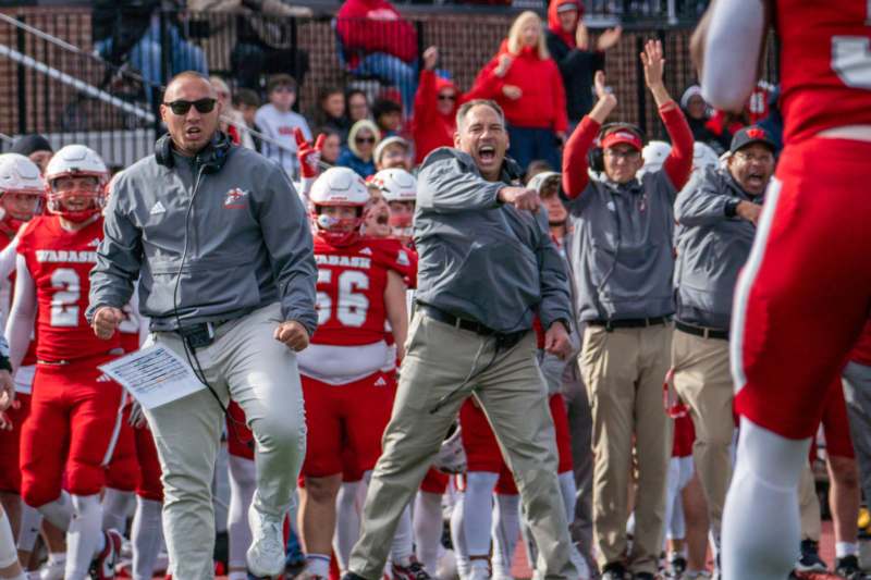 a group of people standing on a field
