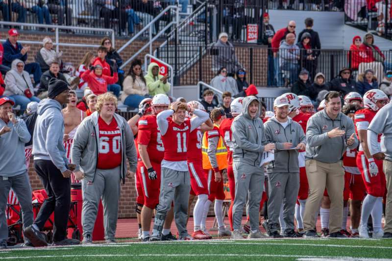 a group of people standing on a field