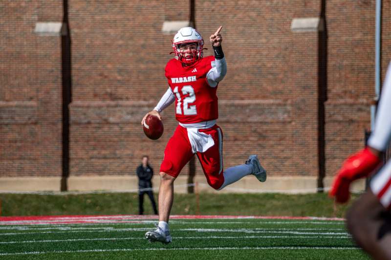 a football player running with a football