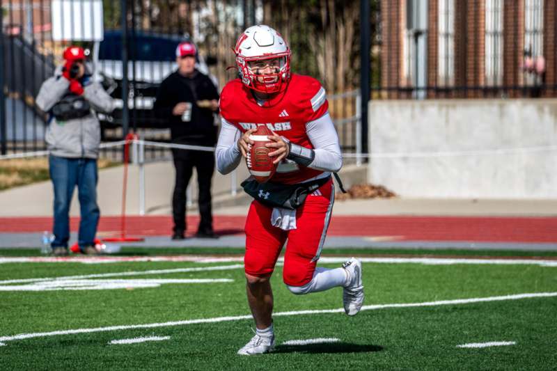 a football player running with a football