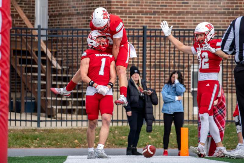 a group of football players celebrating