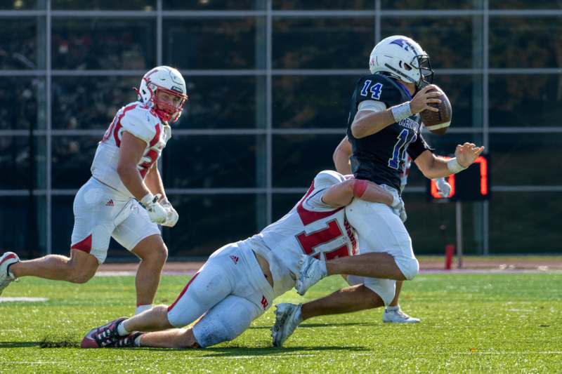 a football player falling down to the ground