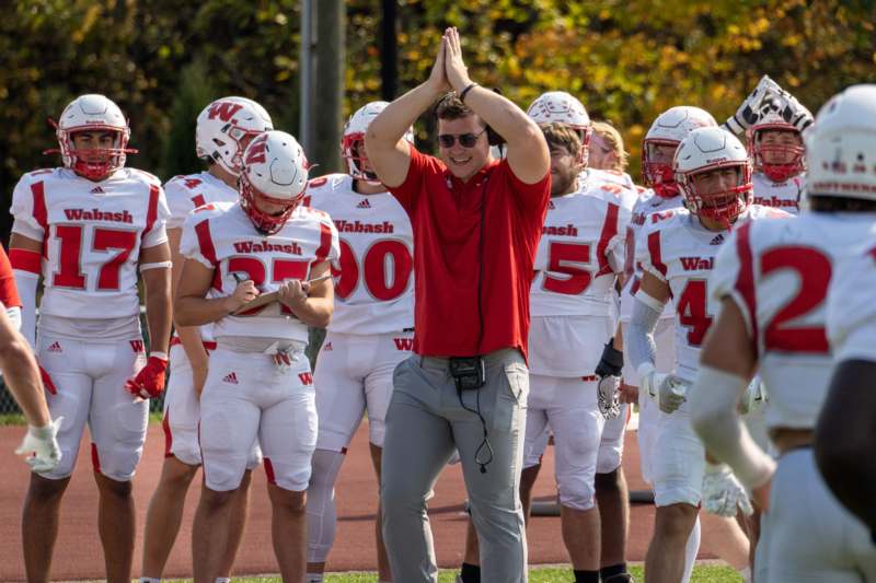 a football player with his hands together