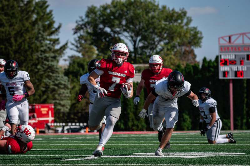a group of people running on a football field