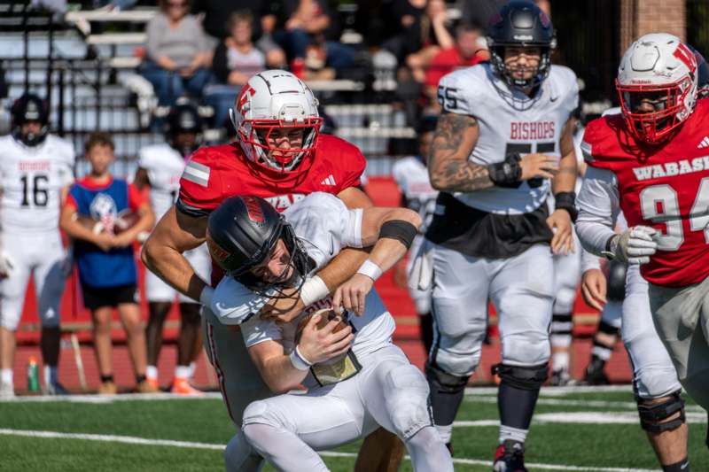 a football player being tackled by a football player