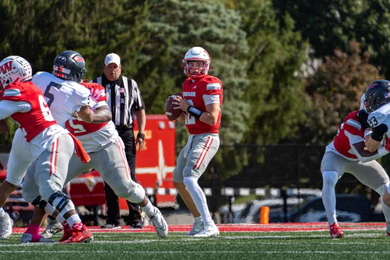a football player running with a football