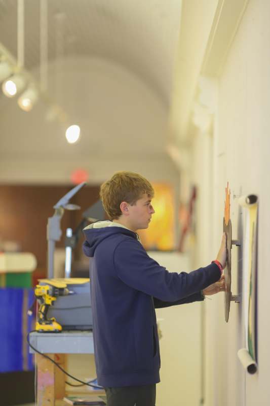 a man touching a wall