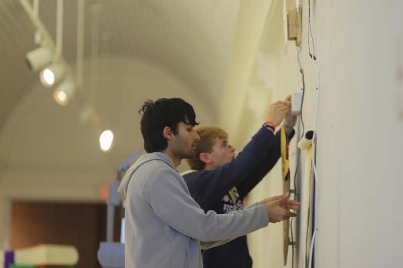 a group of men working on a wall