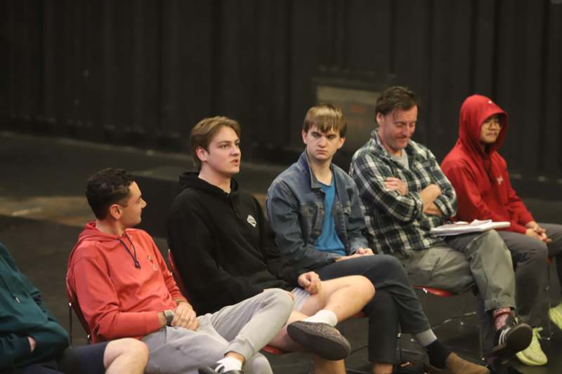 a group of people sitting in chairs