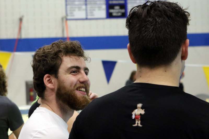 a man with a beard and a shirt with a cartoon on it
