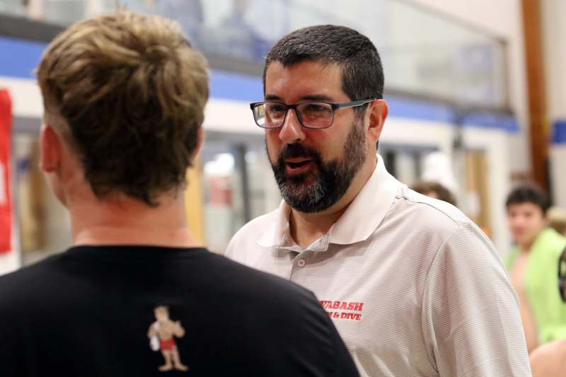 a man talking to another man