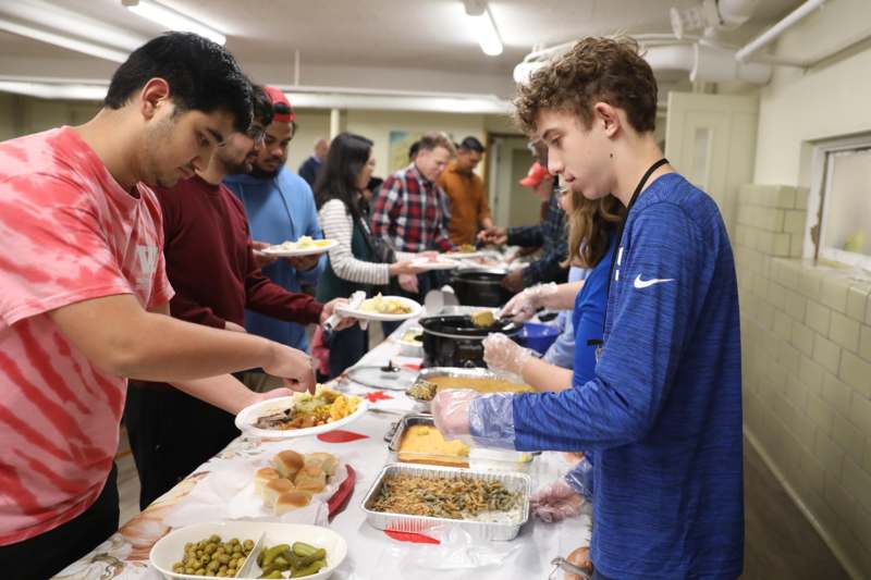 a group of people serving food