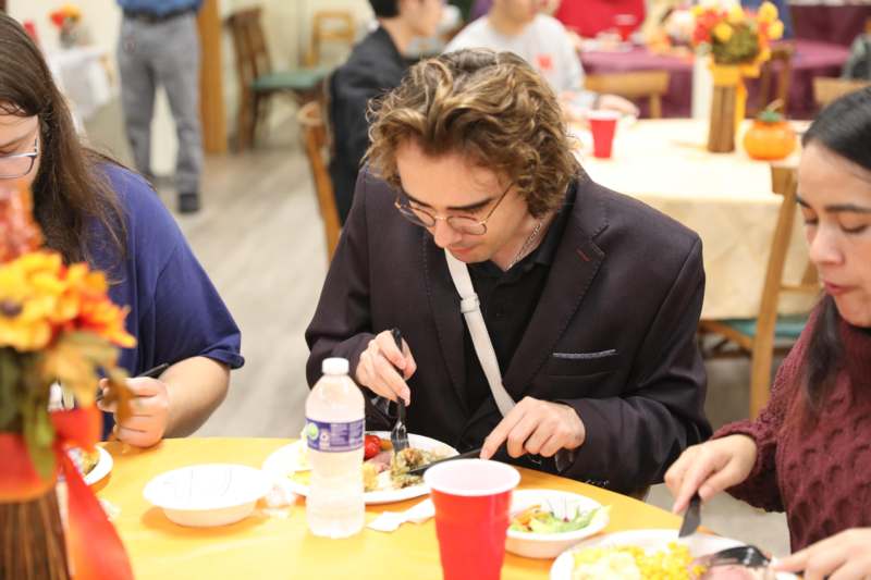 a man eating at a table