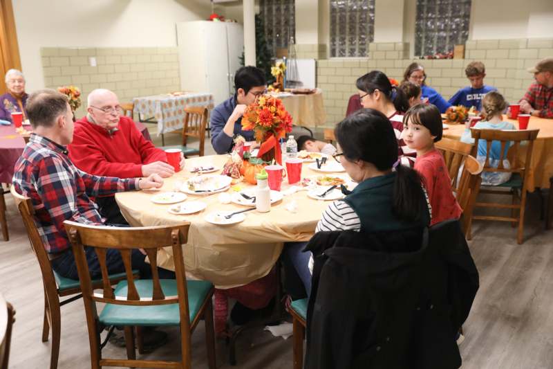 a group of people sitting around a table