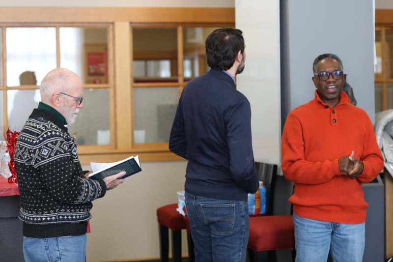 a group of men standing in a room