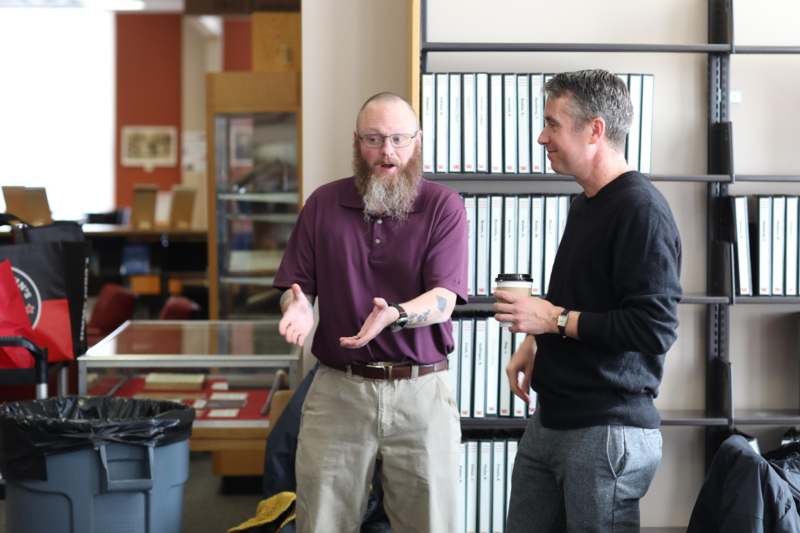 a man talking to another man