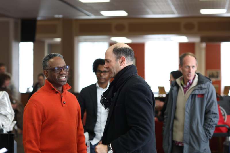 a group of men standing in a room