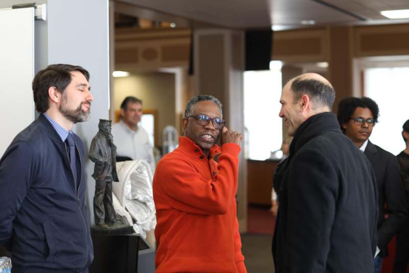 a group of men standing in a room