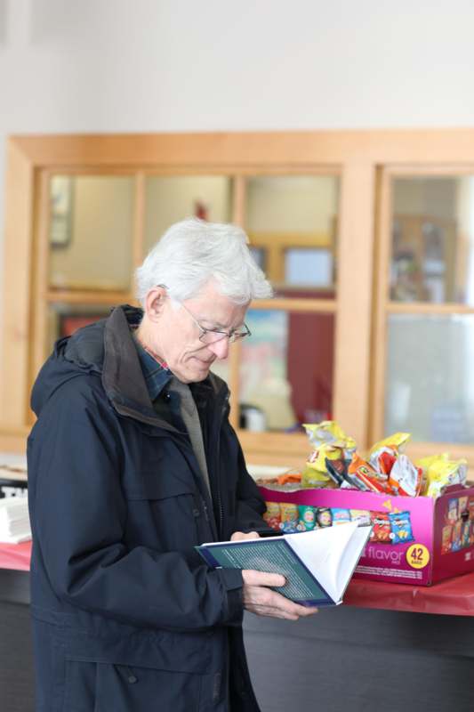 a man holding a book