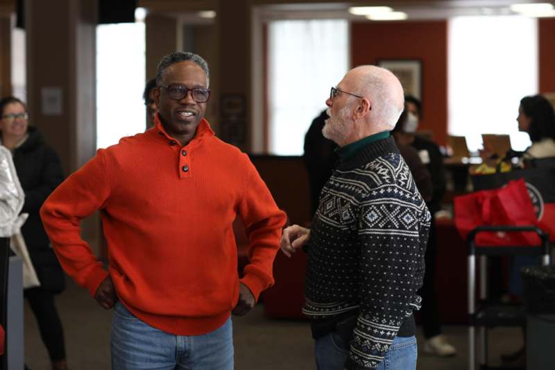 a group of men standing in a room