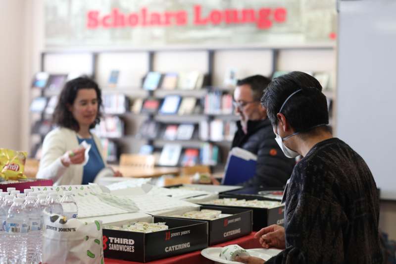 people in a library with a group of people