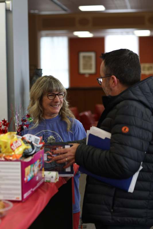 a man and woman standing next to each other