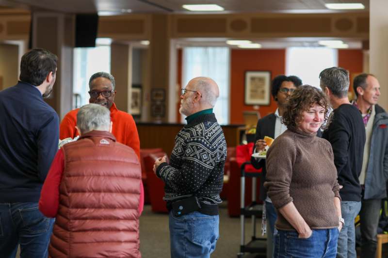 a group of people standing in a room