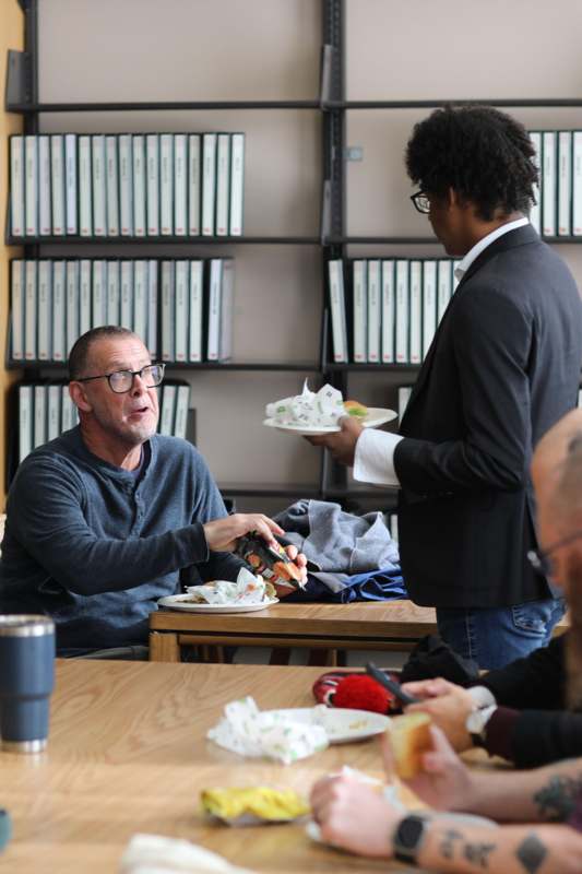 a man holding a plate of food